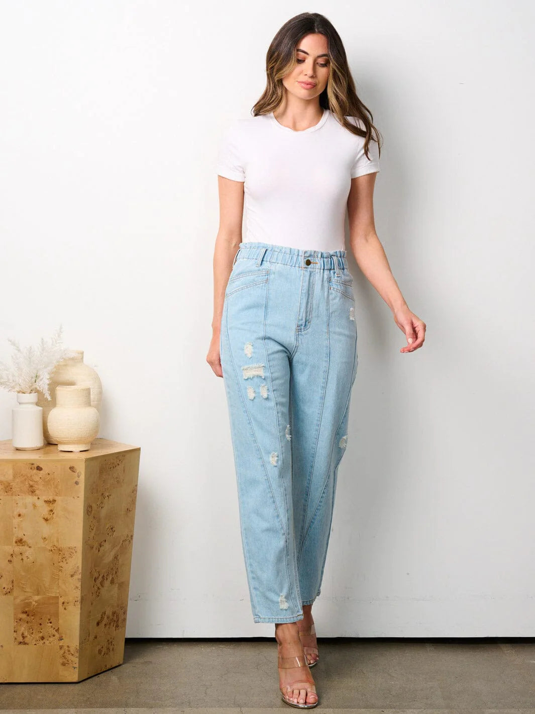 100% cotton women's denim pants. Elastic waist button closure pockets distressed denim jeans